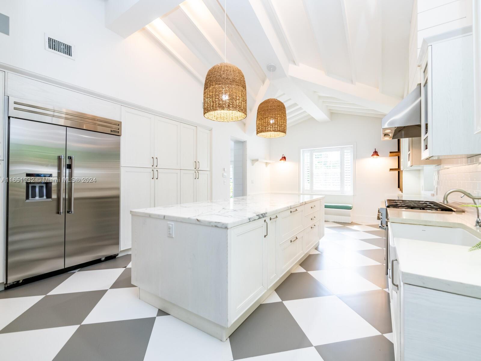 4700 Lake Road Miami, FL 33137 - Photo 40 of 92 a kitchen with granite countertop a sink and stainless steel appliances