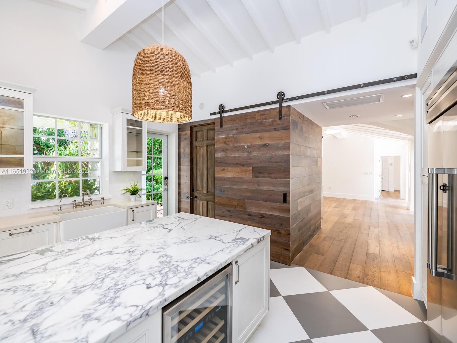 4700 Lake Road Miami, FL 33137 - Photo 53 of 92 a bathroom with a granite countertop sink and a large mirror
