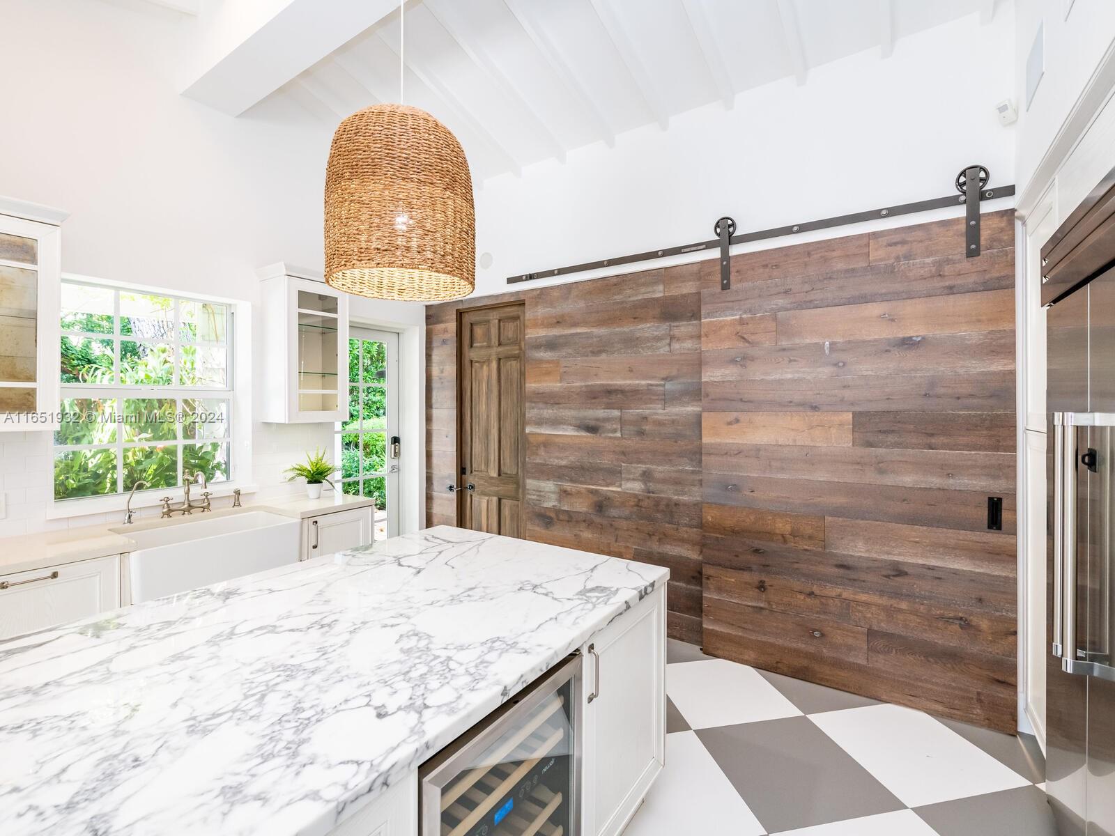 4700 Lake Road Miami, FL 33137 - Photo 54 of 92 a bathroom with a granite countertop sink a large mirror and a shower