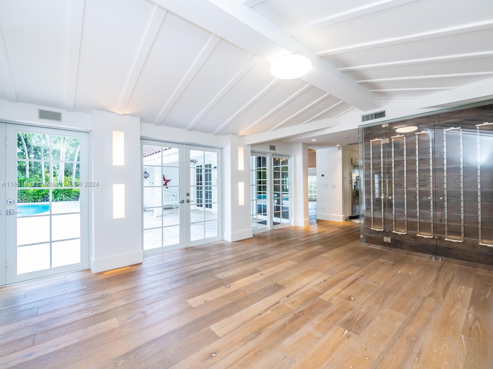 4700 Lake Road Miami, FL 33137 - Photo 59 of 92 a view of an empty room with wooden floor and a window