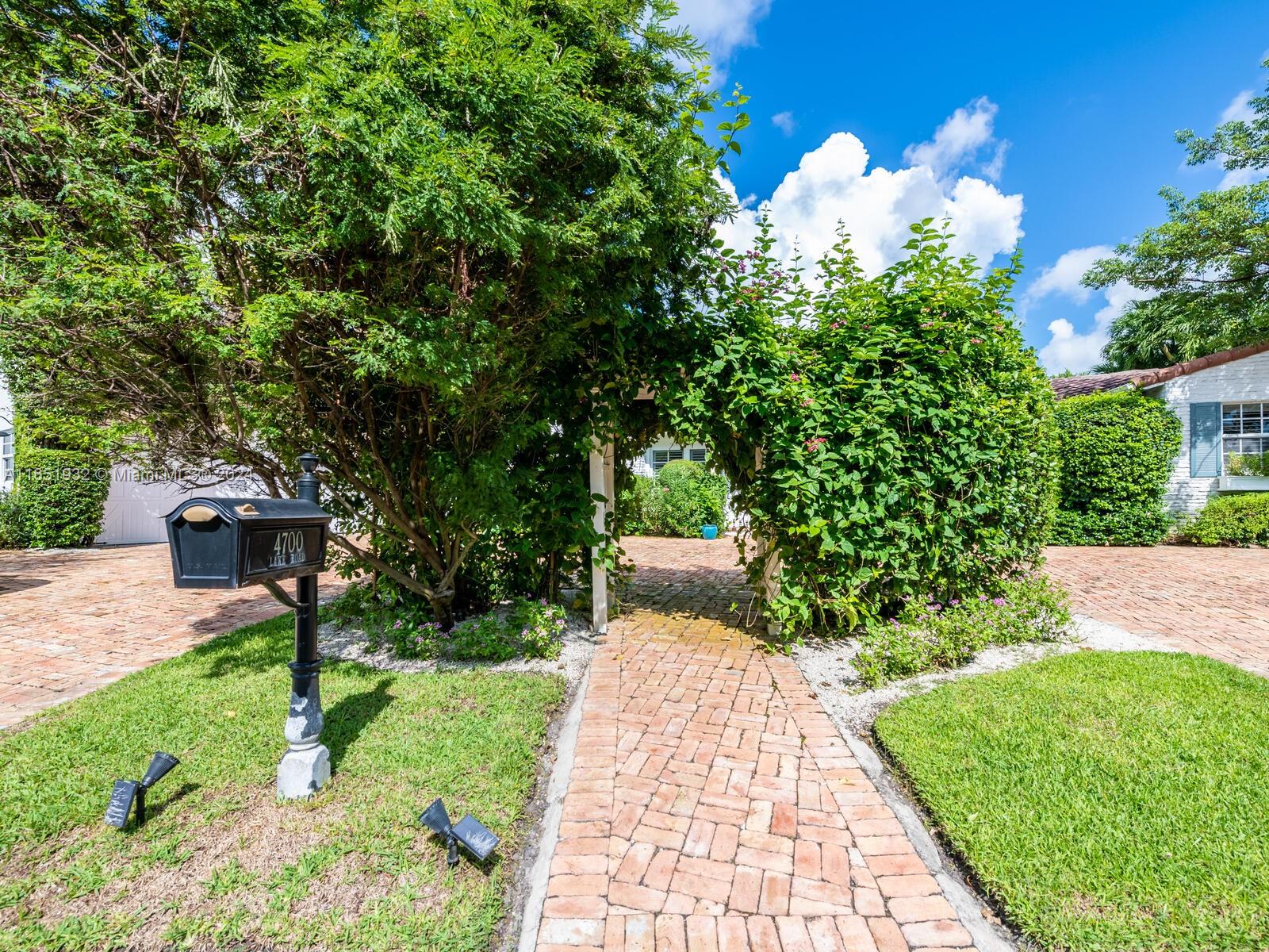 4700 Lake Road Miami, FL 33137 - Photo 7 of 92 a front view of a house with garden