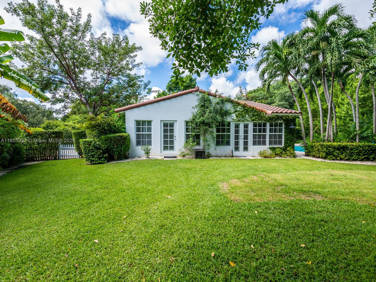 4700 Lake Road Miami, FL 33137 - Photo 80 of 92 a front view of house with yard and green space