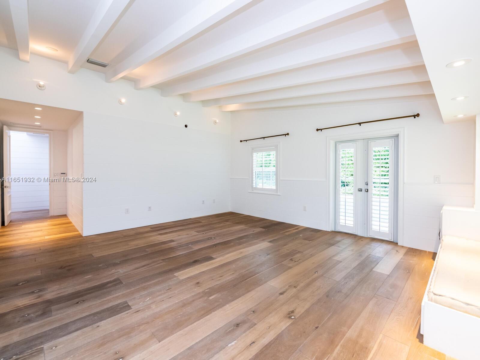 4700 Lake Road Miami, FL 33137 - Photo 83 of 92 a view of empty room with wooden floor and fan