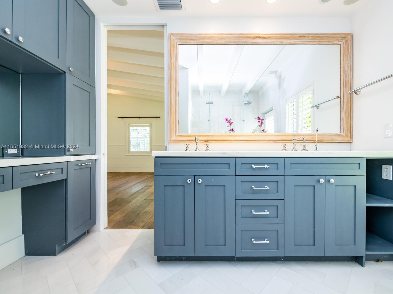4700 Lake Road Miami, FL 33137 - Photo 85 of 92 a bathroom with a granite countertop sink and a mirror
