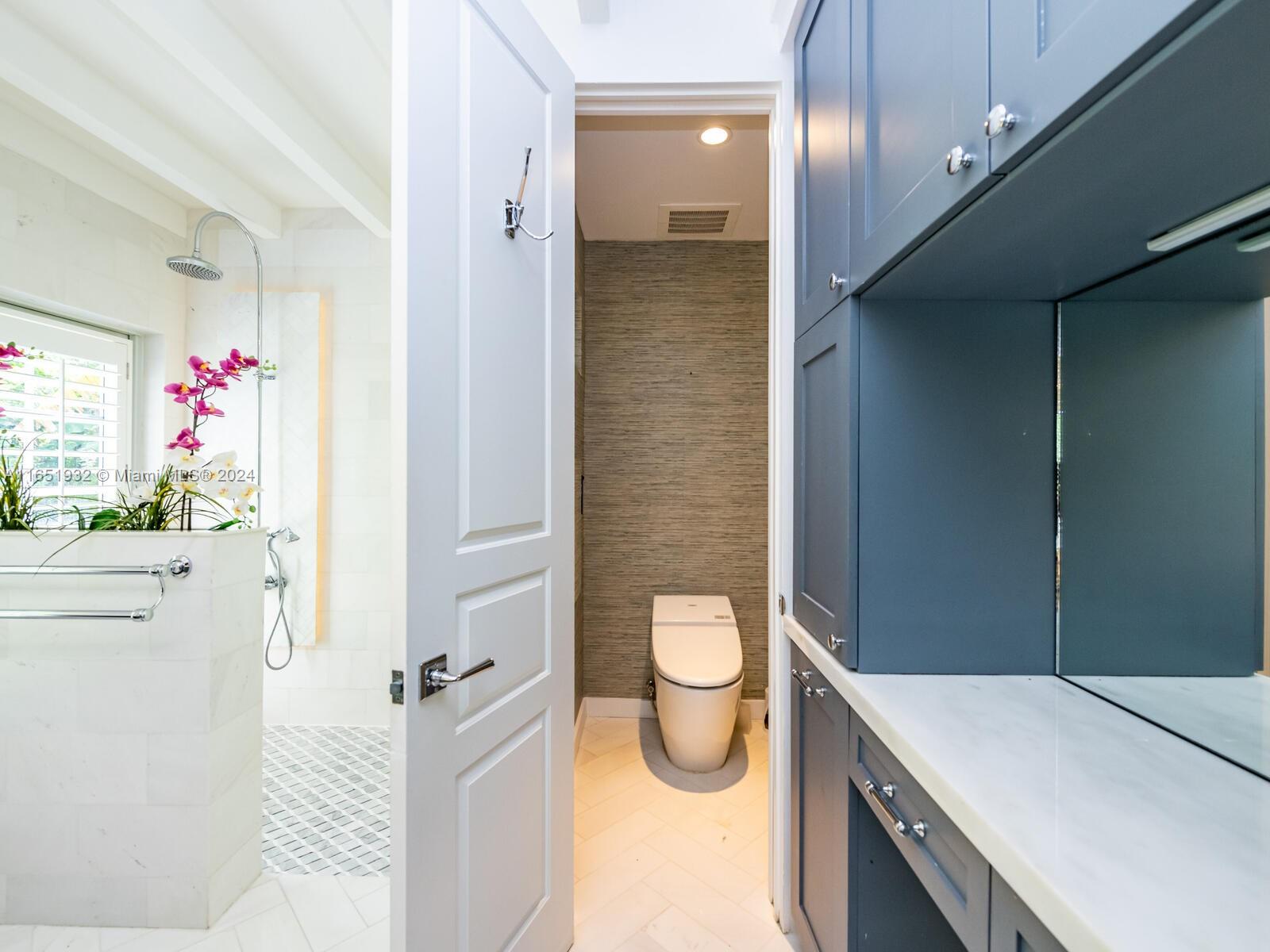 4700 Lake Road Miami, FL 33137 - Photo 91 of 92 a bathroom with a sink a toilet and shower