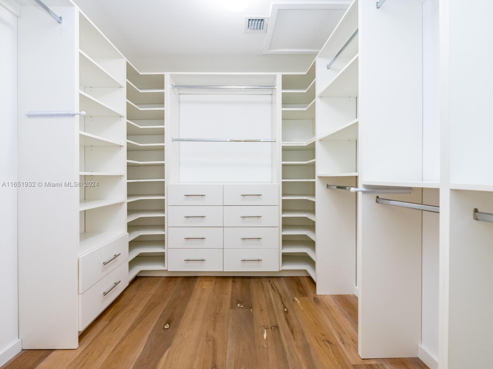 4700 Lake Road Miami, FL 33137 - Photo 92 of 92 a view of walk in closet with empty racks
