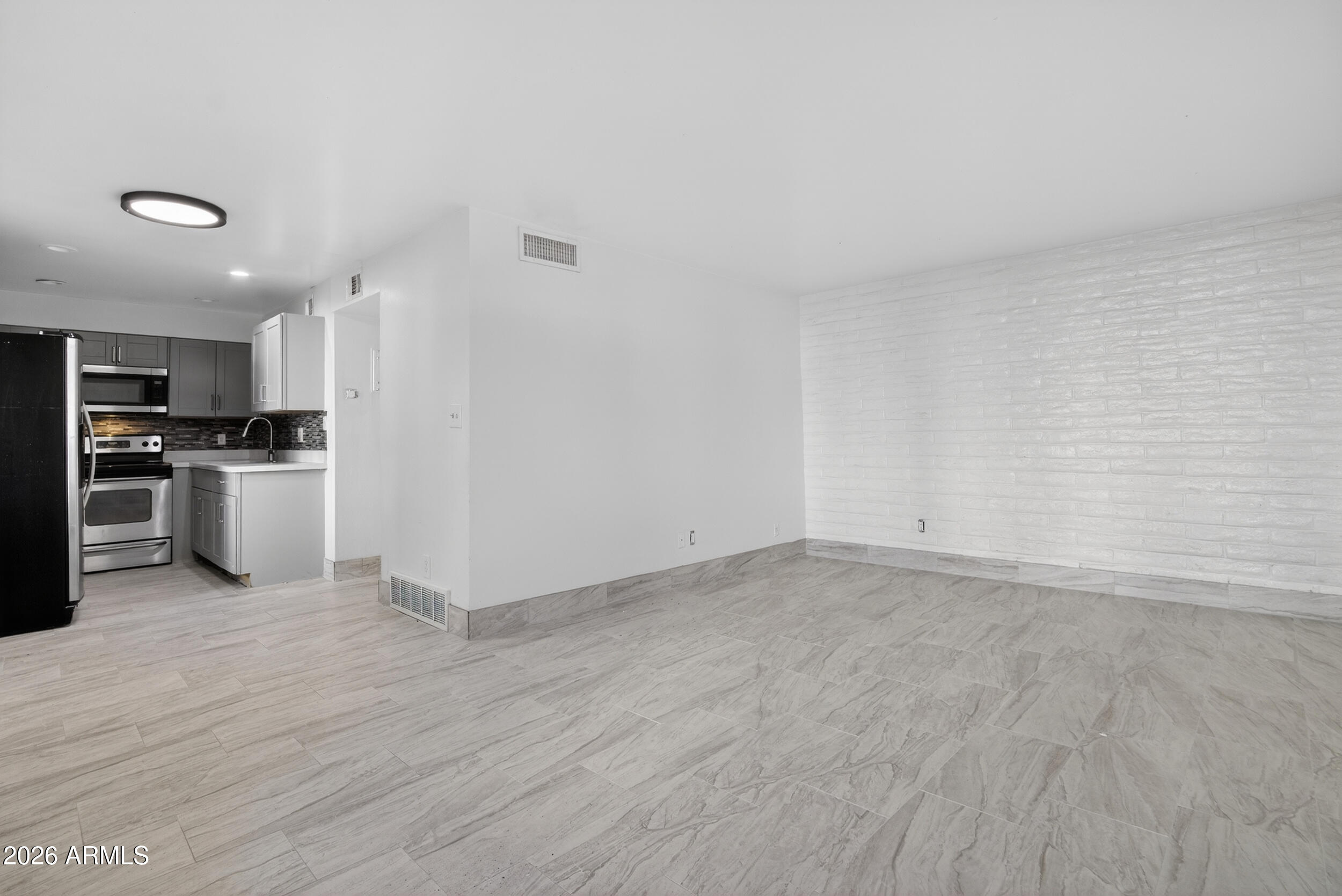 2925 North 38th Street, Unit 2 Phoenix, AZ 85018 - Photo 13 of 21 a view of a kitchen with a sink and a refrigerator