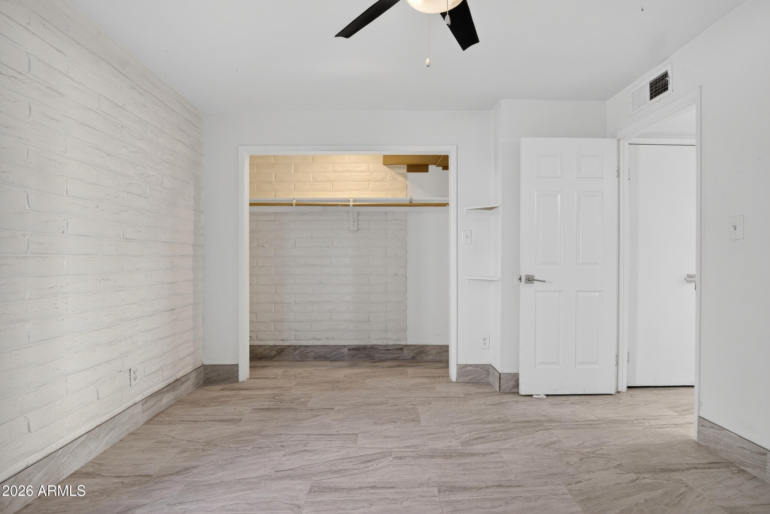 2925 North 38th Street, Unit 2 Phoenix, AZ 85018 - Photo 19 of 21 an empty room with closet and windows