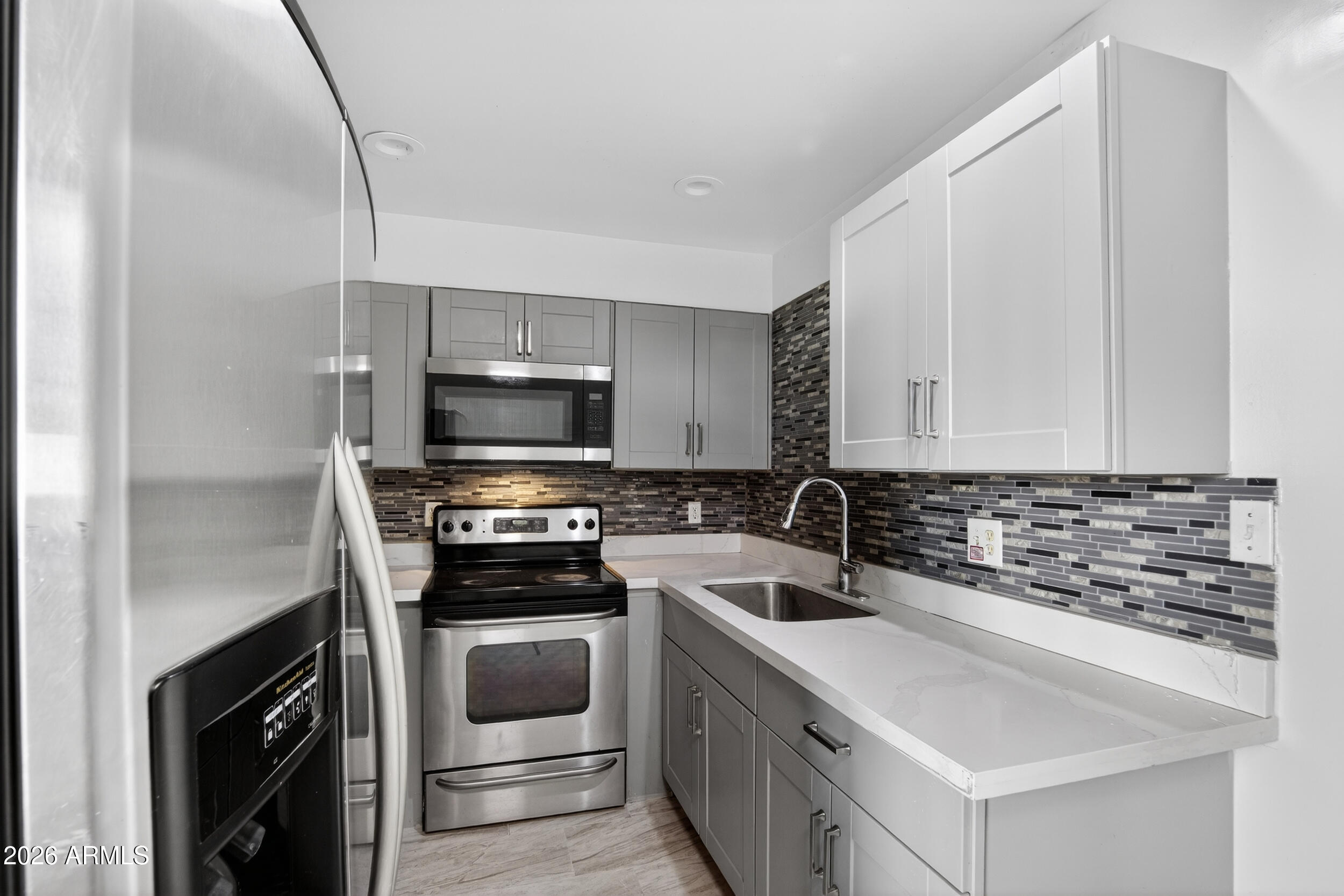 2925 North 38th Street, Unit 2 Phoenix, AZ 85018 - Photo 2 of 21 a kitchen with a sink and steel appliances