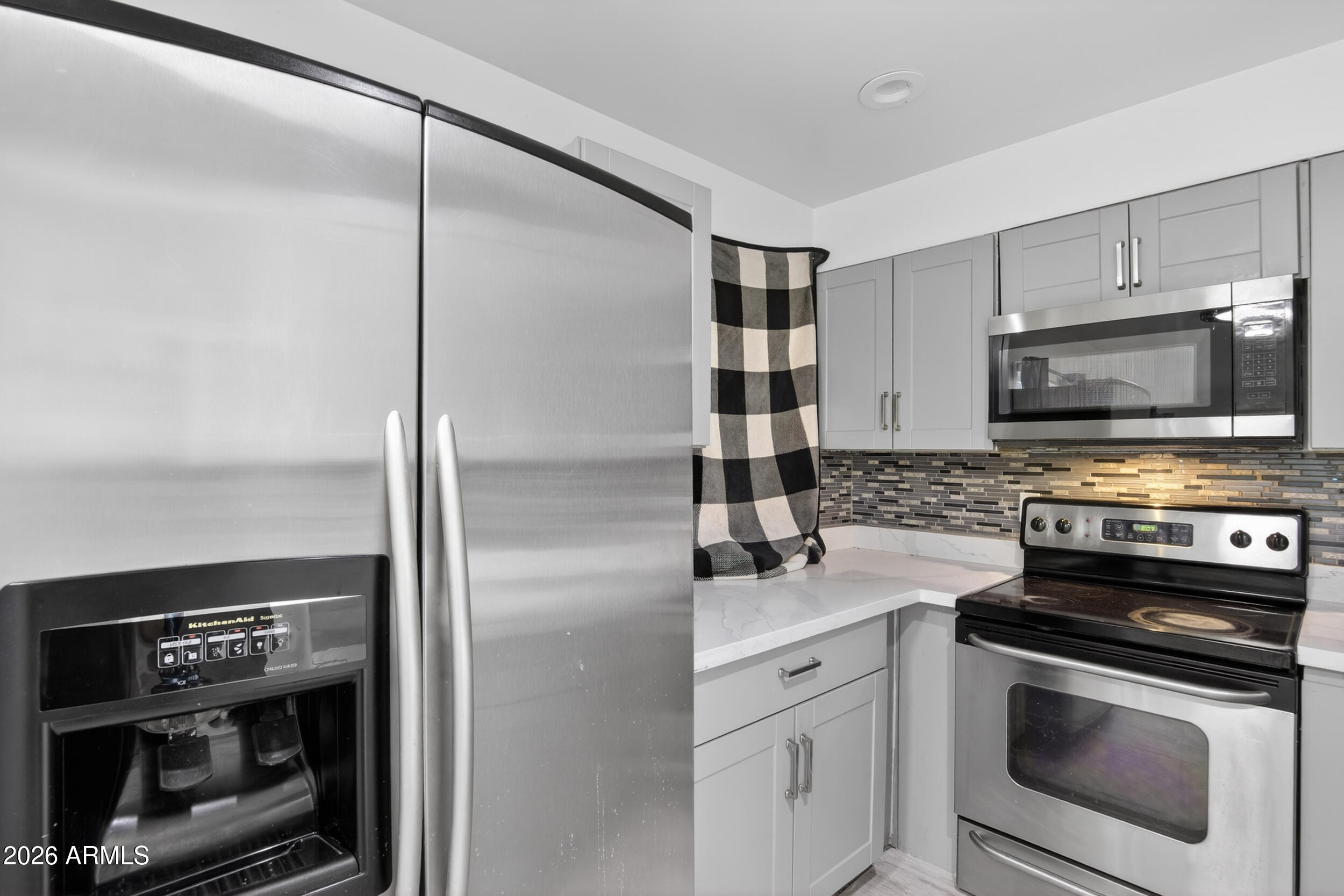 2925 North 38th Street, Unit 2 Phoenix, AZ 85018 - Photo 3 of 21 a kitchen with a refrigerator stove and microwave