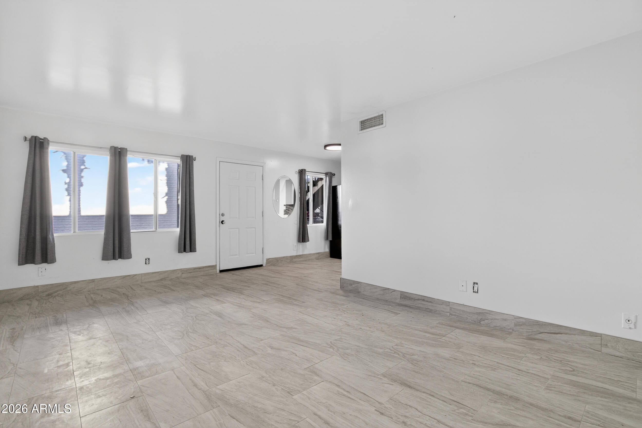 2925 North 38th Street, Unit 2 Phoenix, AZ 85018 - Photo 7 of 19 a view of an empty room with glass door