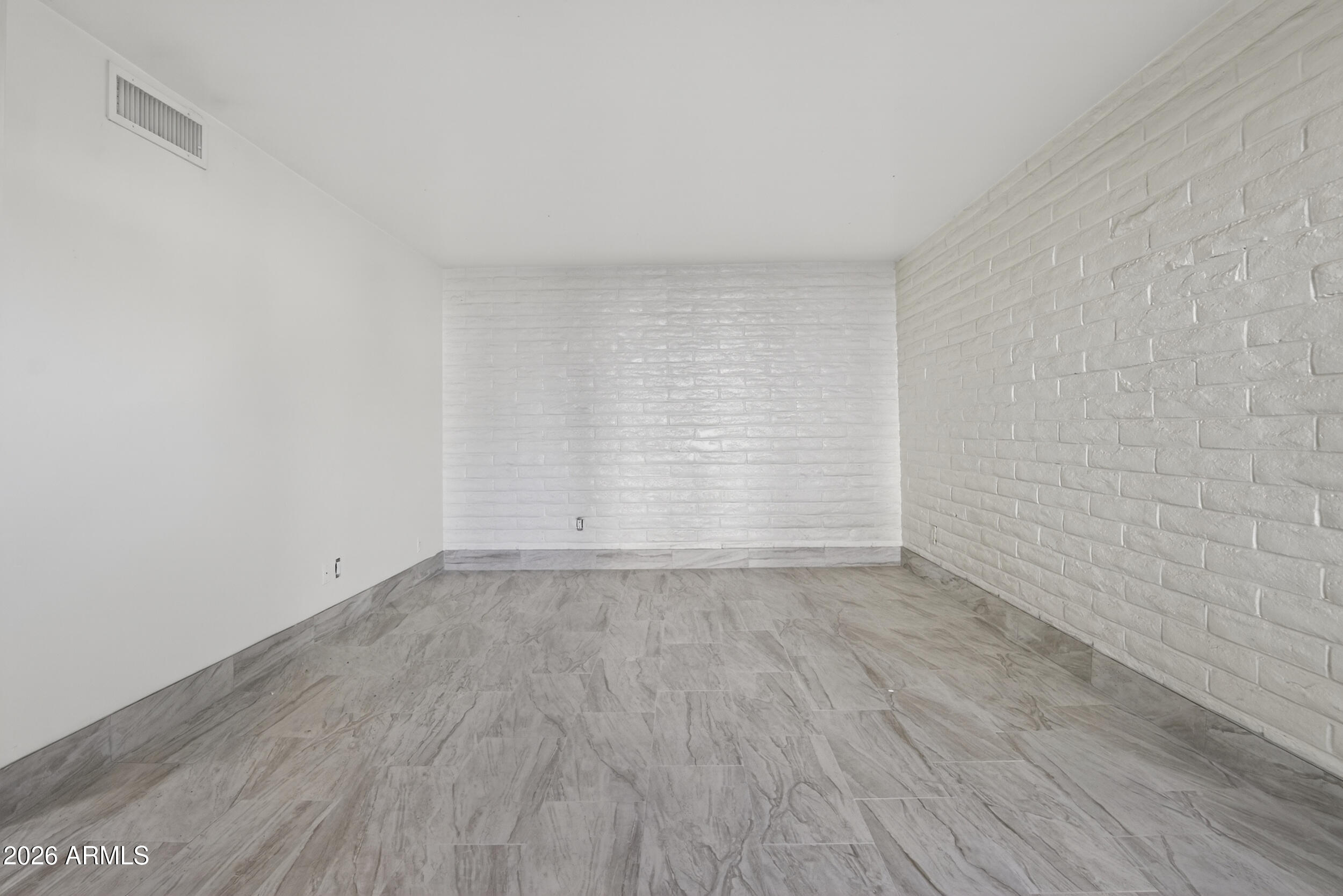 2925 North 38th Street, Unit 2 Phoenix, AZ 85018 - Photo 9 of 19 a view of an empty room and wooden floor
