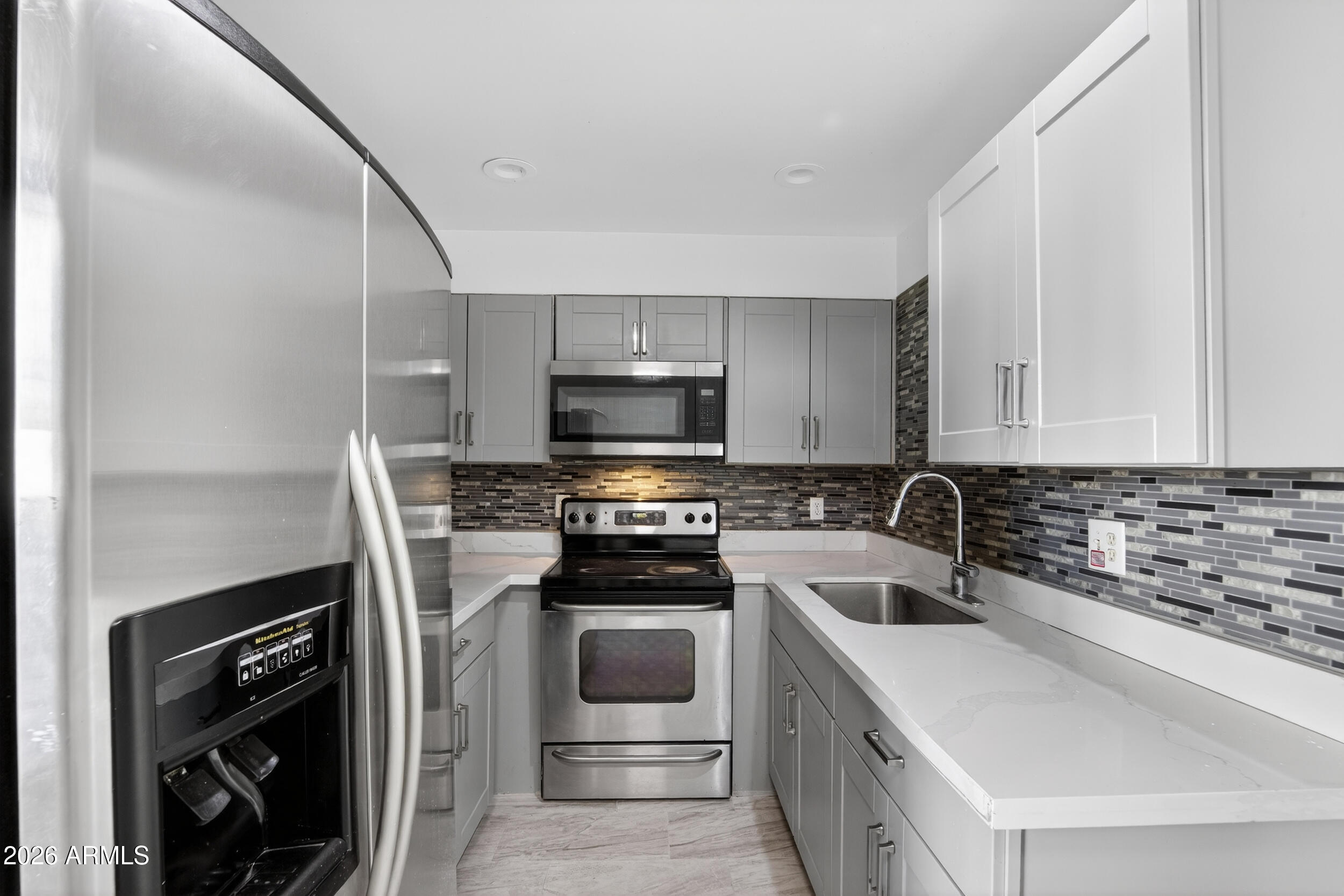 2925 North 38th Street, Unit 2 Phoenix, AZ 85018 - Photo 9 of 21 a kitchen with a sink stove and microwave