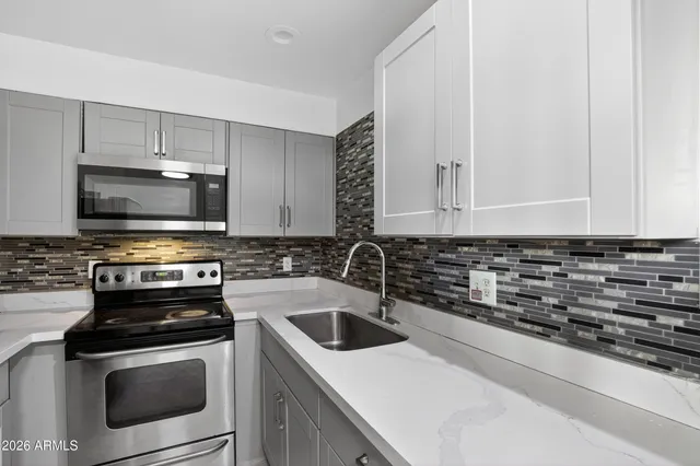 a view of a kitchen with a sink