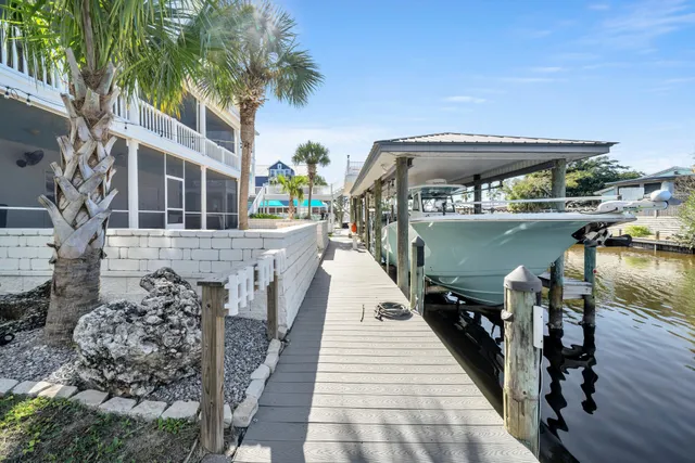 a kitchen with stainless steel appliances a refrigerator sink and microwave