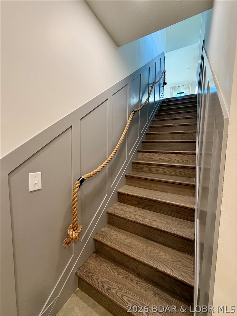 139 Jumping Bass Cove Road Roach, MO 65787 - Photo 33 of 59 staircase to lower level