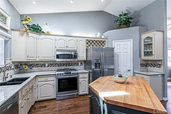 a kitchen with a sink stove and refrigerator