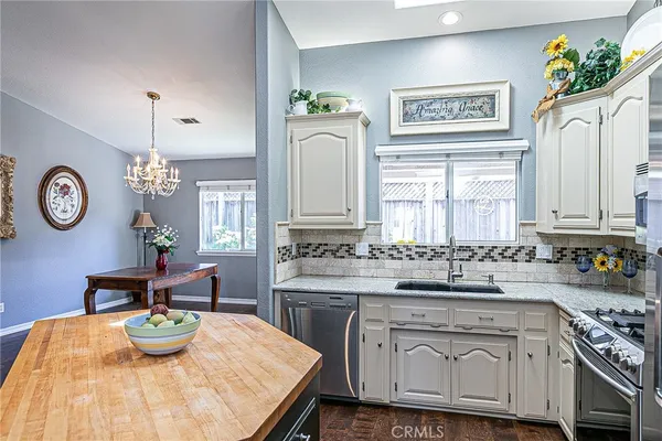 a kitchen with a stove and cabinets