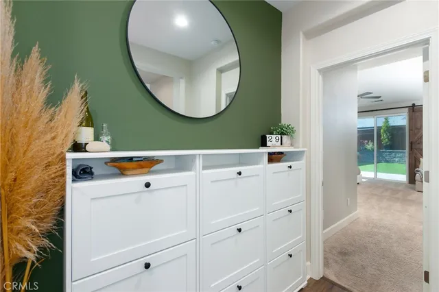 a spacious bedroom with a bed and glass window