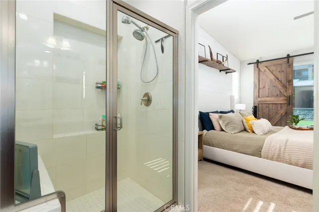 a bathroom with a bathtub and a shower