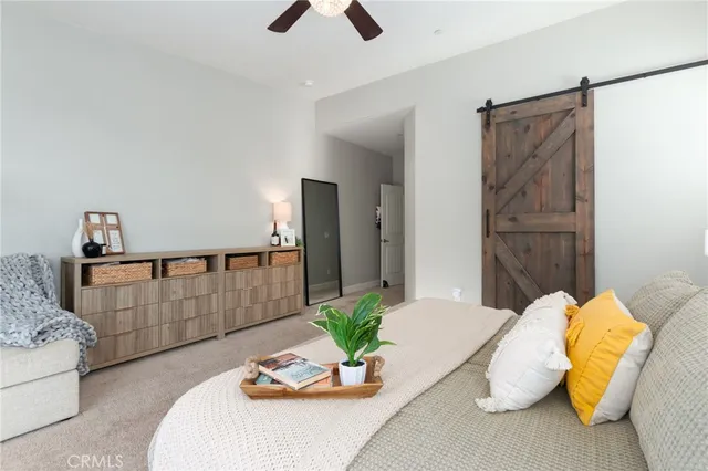 a living room with furniture window and a fireplace