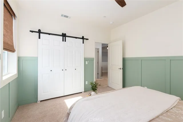 a view of a house with pool and a yard