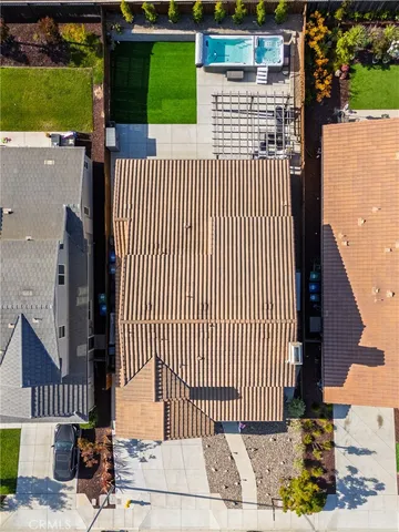 a view of a patio with a dining table and chairs with a wooden fence
