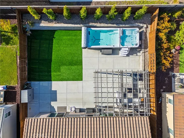 a view of a house with backyard porch and sitting area