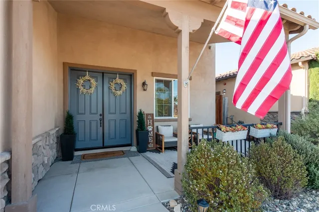 a view of front door and porch with furniture