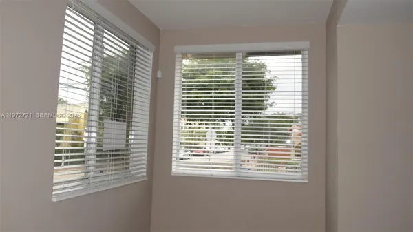 a view of a room that has a window in it