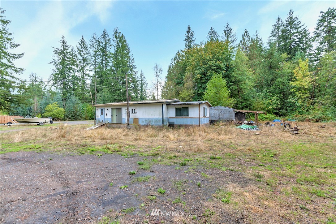 12315 Littlerock Road Southwest Olympia, WA 98512 - Photo 11 of 38 a view of a house with backyard and trees