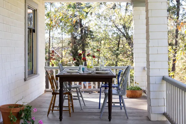a backyard of a house with lots of green space and fountain