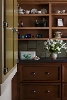 a view of a dining room with furniture and window