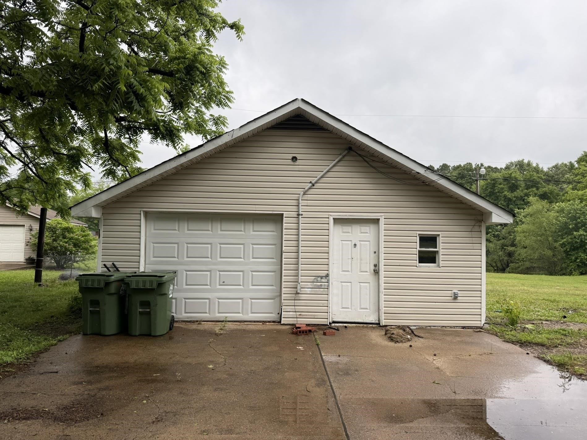 3794 Lucy Road Millington, TN 38053 - Photo 35 of 40 Detached garage structure featuring light-colored siding and a gabled roofline