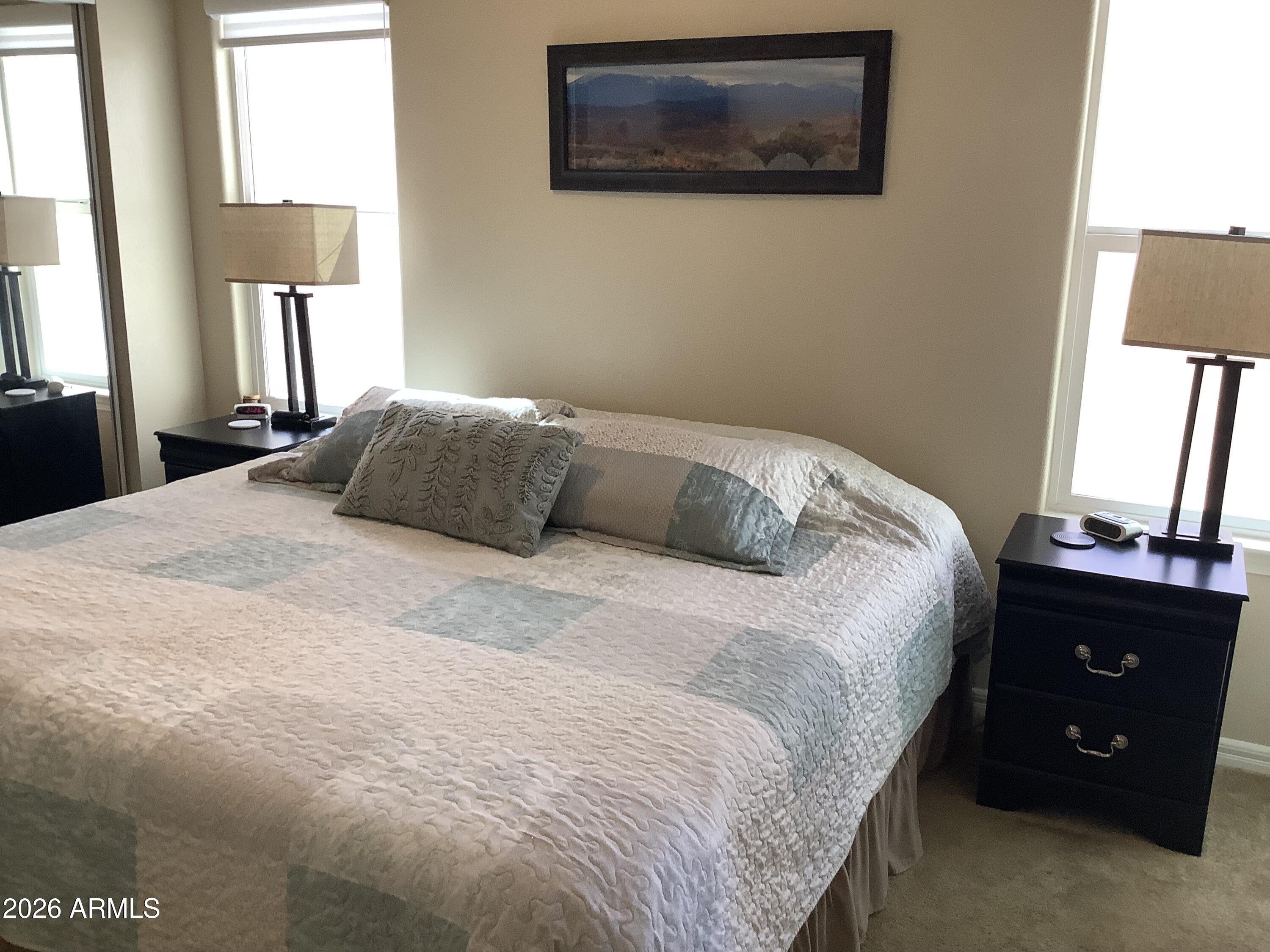 650 North Hawes Road, Unit 4007 Mesa, AZ 85207 - Photo 13 of 42 a bedroom with a bed and a window