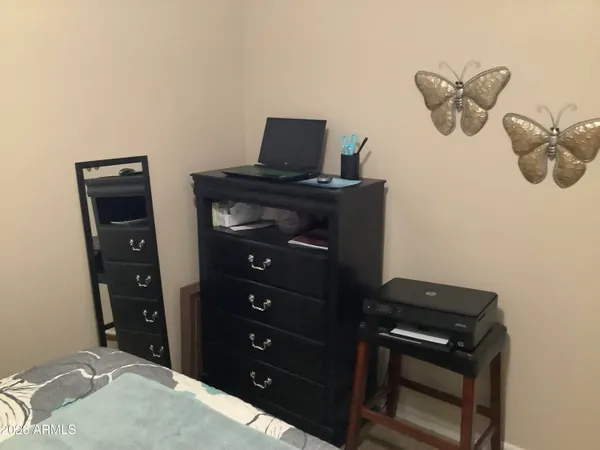 a bedroom with a bed and cabinets