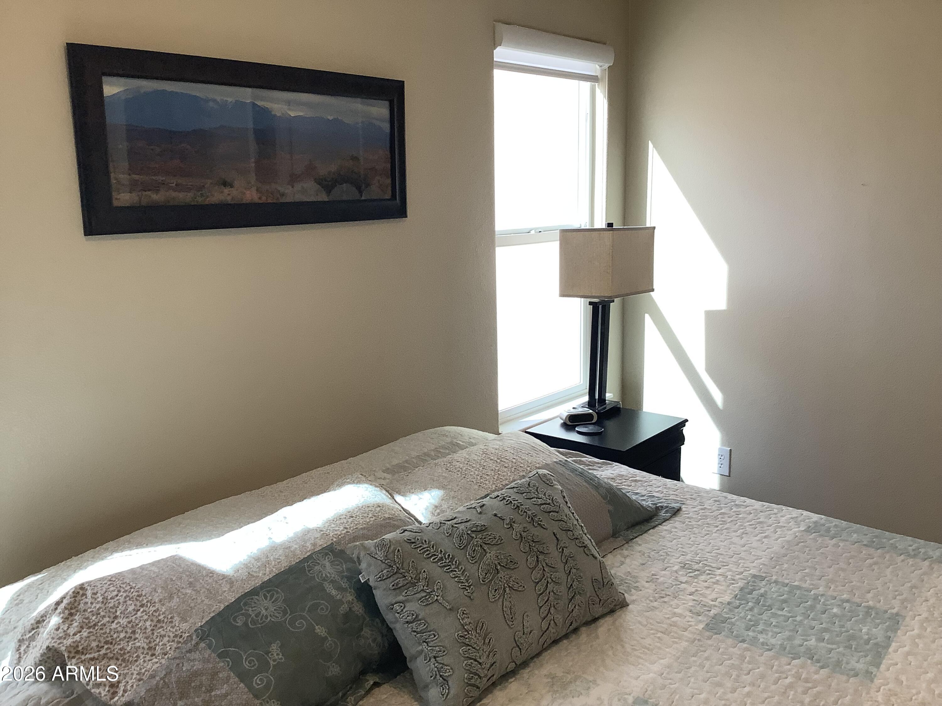 650 North Hawes Road, Unit 4007 Mesa, AZ 85207 - Photo 25 of 42 a bedroom with a bed and a window