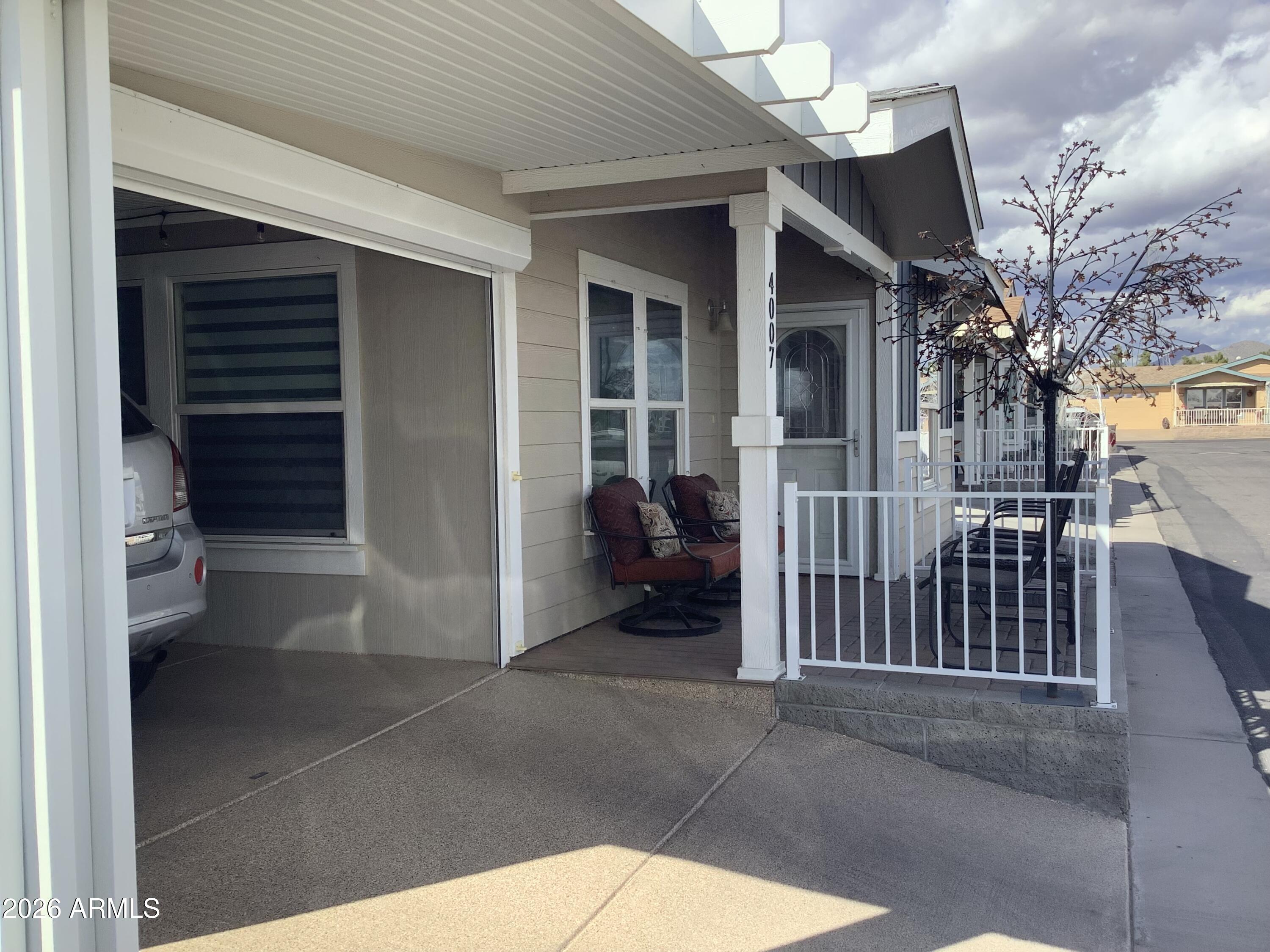 650 North Hawes Road, Unit 4007 Mesa, AZ 85207 - Photo 32 of 42 a view of a porch with a tv