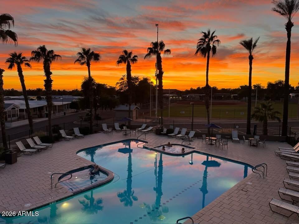 650 North Hawes Road, Unit 4007 Mesa, AZ 85207 - Photo 37 of 42 a view of a swimming pool with a patio