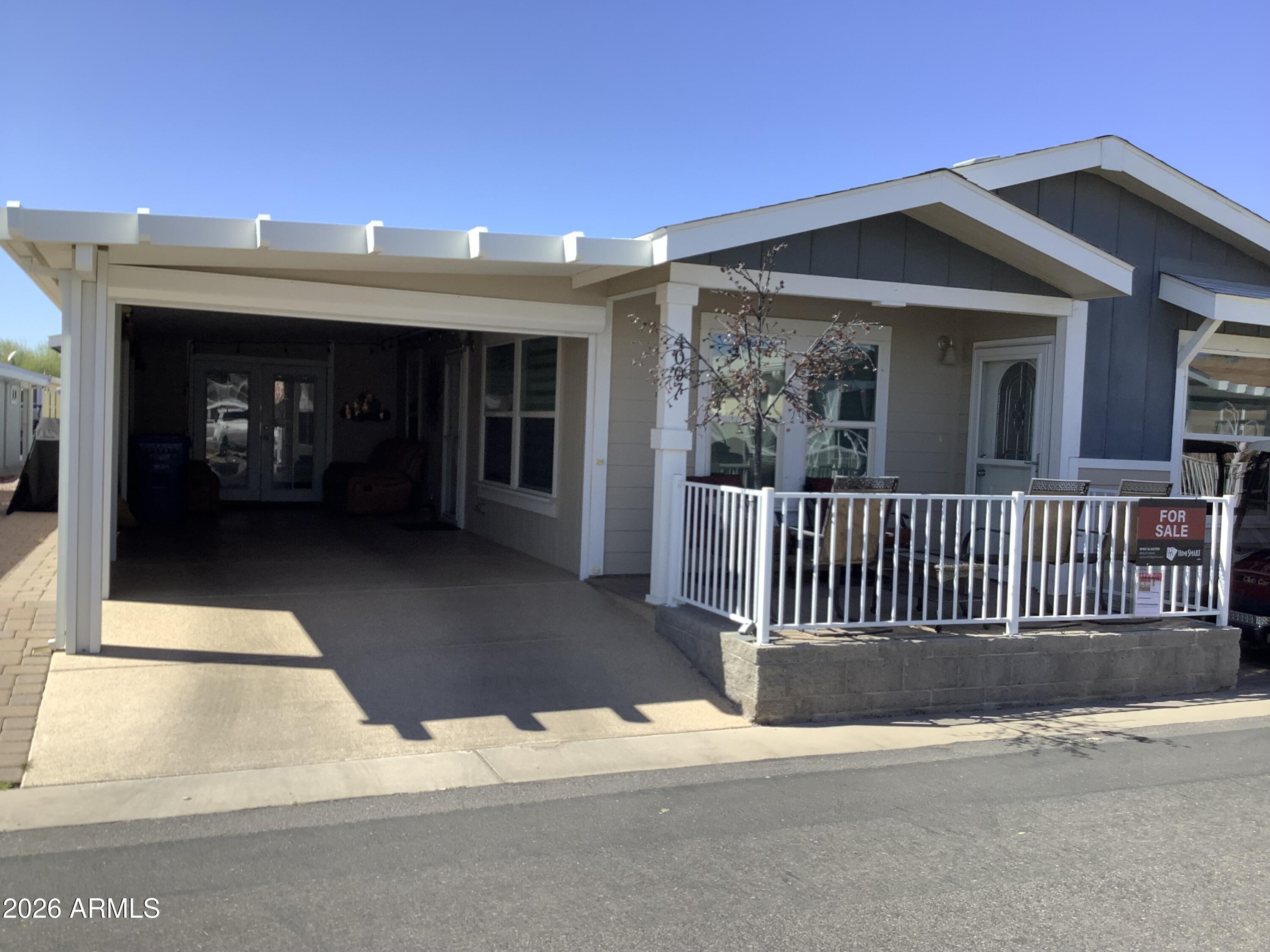 650 North Hawes Road, Unit 4007 Mesa, AZ 85207 - Photo 4 of 42 a view of a house with a porch