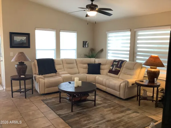 a living room with furniture and a large window
