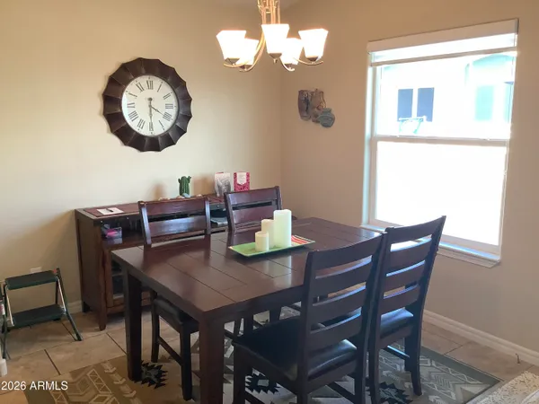 a view of a dining table and chairs in a room