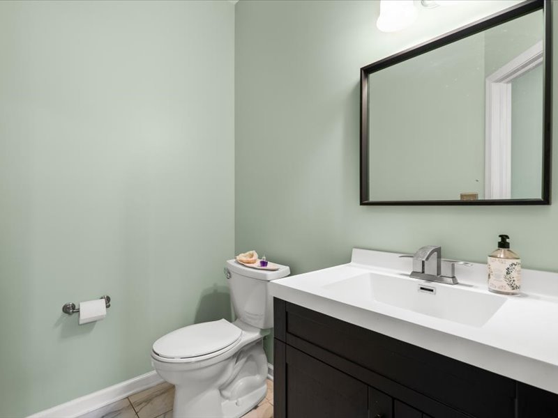 2147 Pembridge Lane Joliet, IL 60431 - Photo 14 of 34 a bathroom with a sink a toilet and mirror
