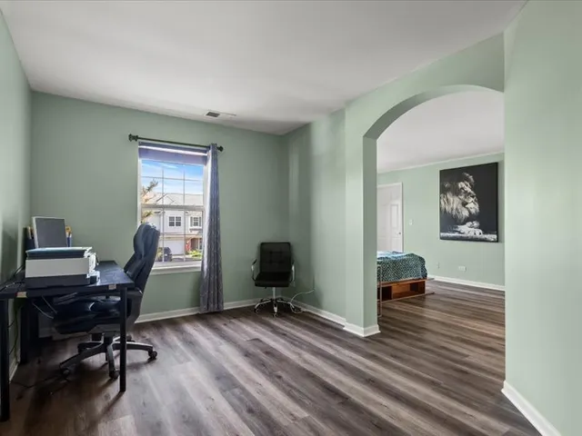 a workspace with furniture hardwood and a window