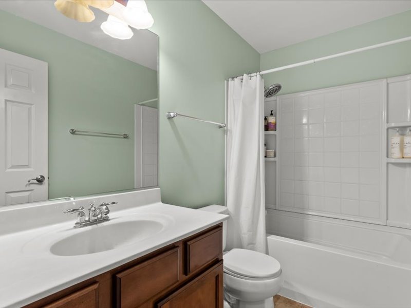 2147 Pembridge Lane Joliet, IL 60431 - Photo 21 of 34 a bathroom with a sink a toilet and shower