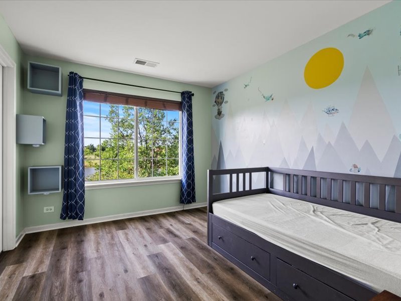 2147 Pembridge Lane Joliet, IL 60431 - Photo 23 of 34 a view of a room with wooden floor and window