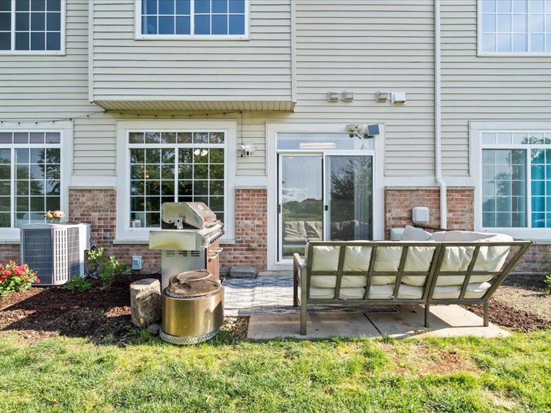 2147 Pembridge Lane Joliet, IL 60431 - Photo 24 of 34 a view of a house with backyard and sitting area