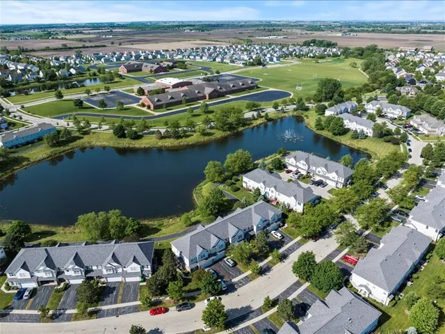an aerial view of a house with a lake view