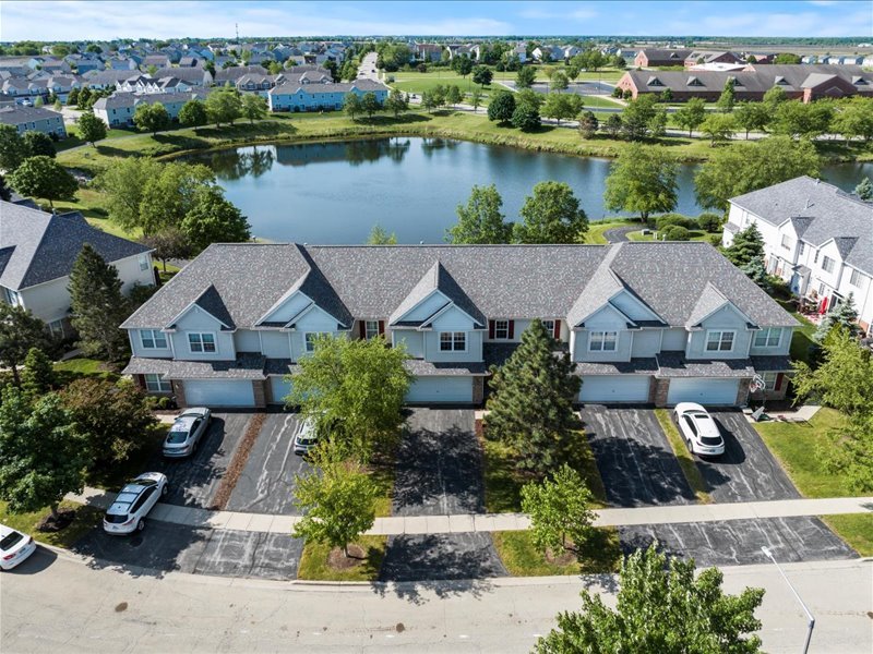 2147 Pembridge Lane Joliet, IL 60431 - Photo 31 of 34 an aerial view of a house with a lake view