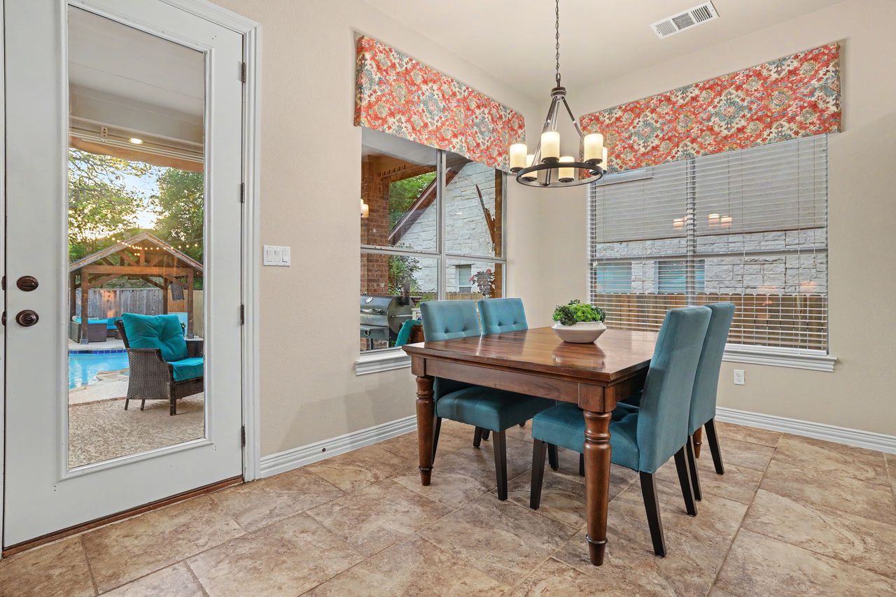 2828 Collingwood Drive Round Rock, TX 78665 - Photo 15 of 38 a view of a dining room with furniture window and outside view